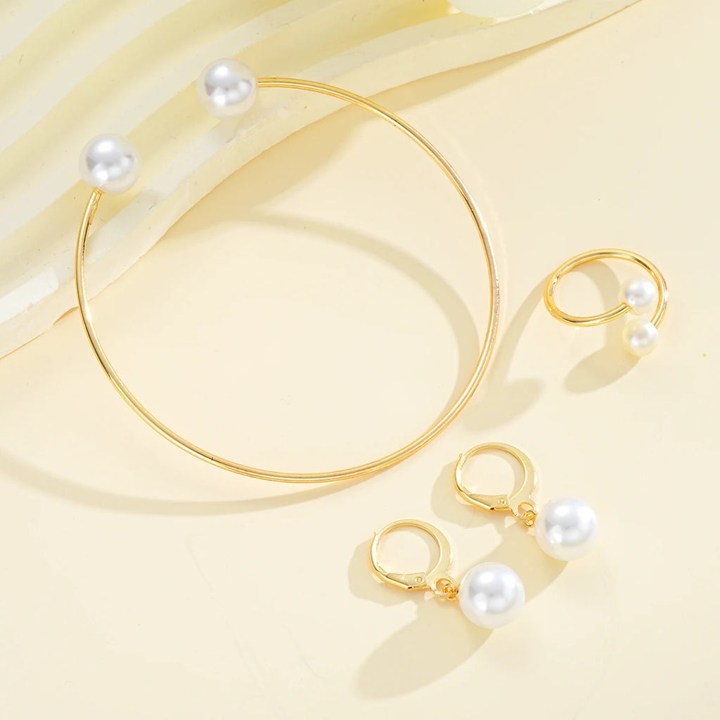 4-piece women’s pearl jewelry set. Gold-tone vintage style for special occasions