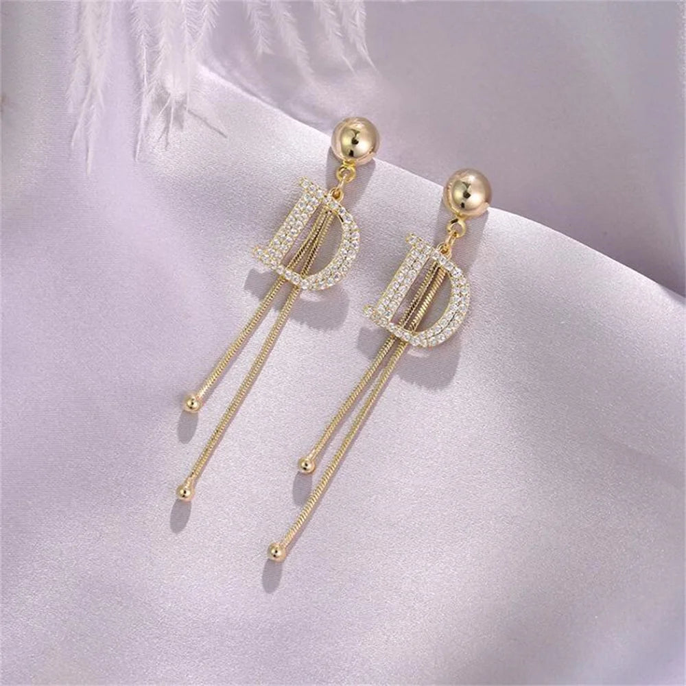 Elegant Gold Tassel Earrings with Crystal Letter D