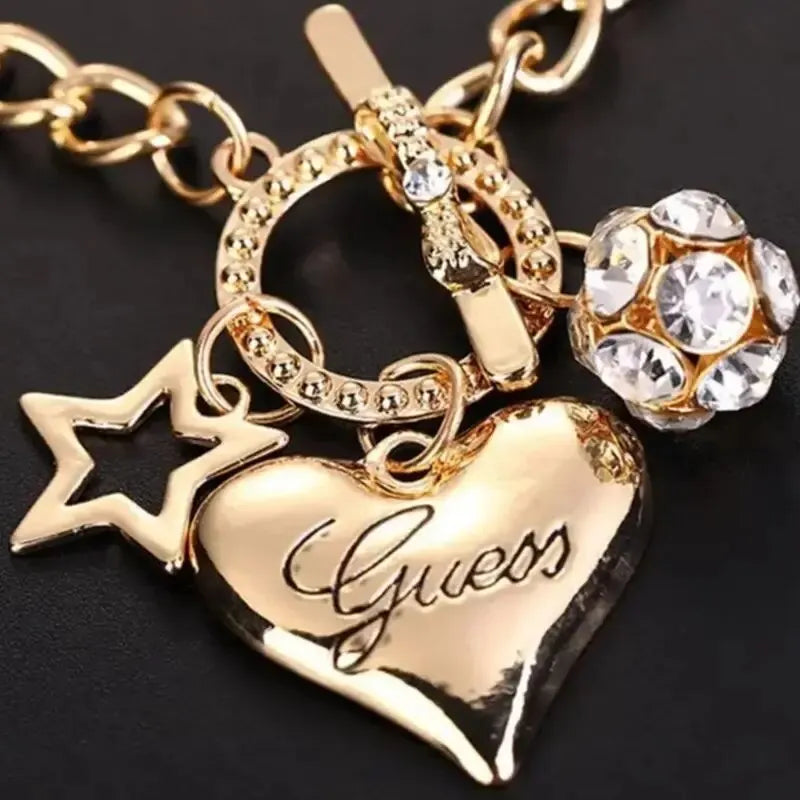 Hollow Heart Charm Bracelet for Women – Pearl & Fireball Accents.