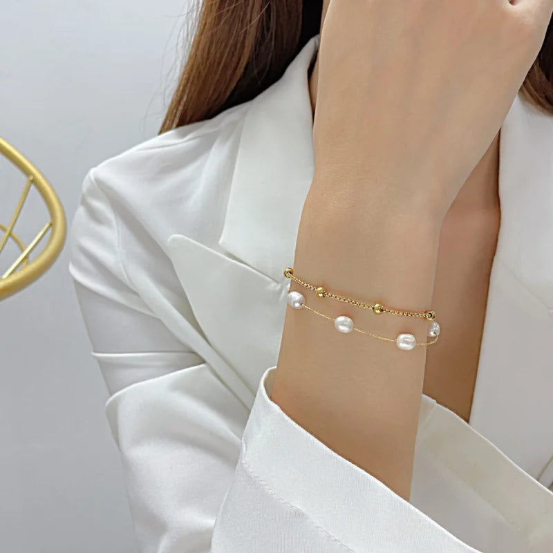 Yupsk double-layer stainless steel pearl bracelet. Gold-tone, elegant daily wear