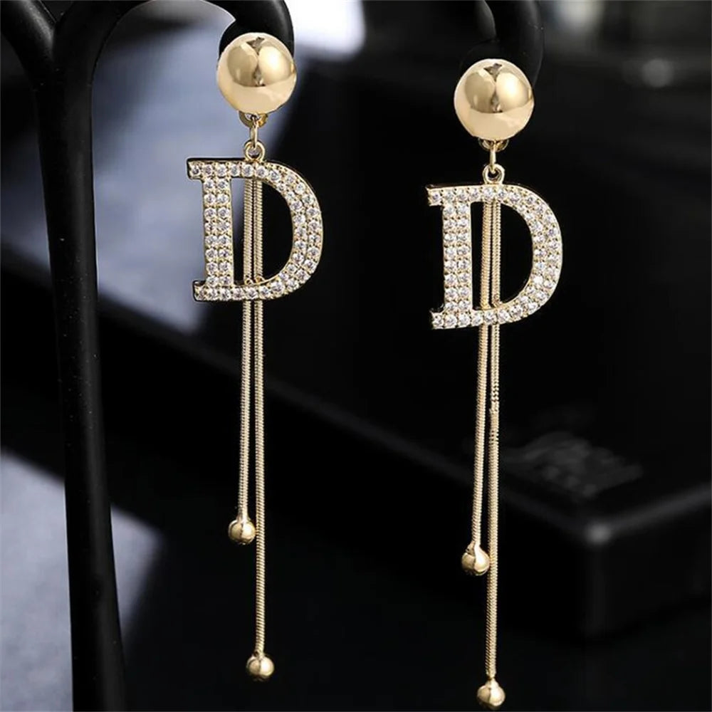 Elegant Gold Tassel Earrings with Crystal Letter D