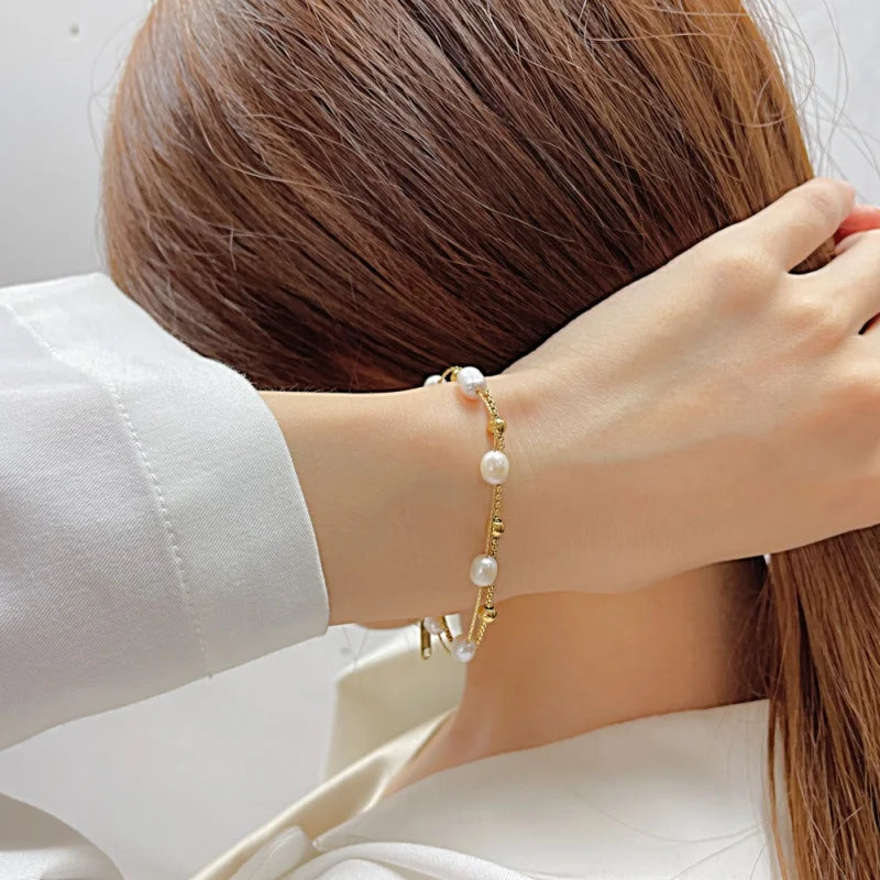 Yupsk double-layer stainless steel pearl bracelet. Gold-tone, elegant daily wear