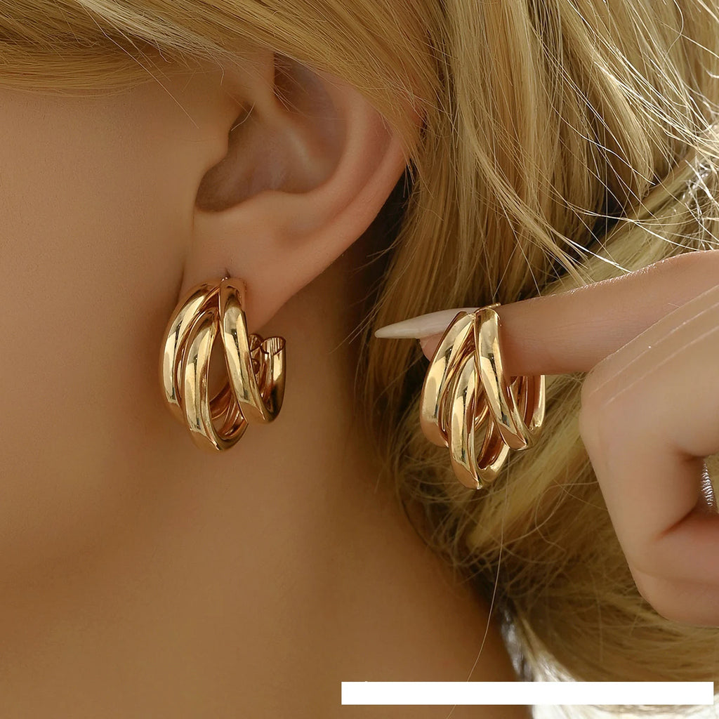 Elegant gold-tone geometric hoop earrings. A bold vintage statement for parties and special occasions