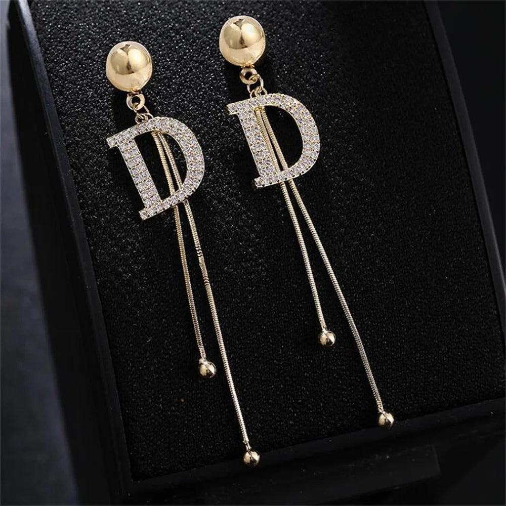 Elegant Gold Tassel Earrings with Crystal Letter D